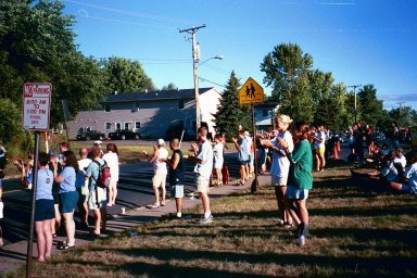 cheering riders into camp